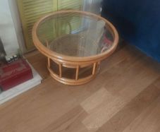 Round wicker coffee table with glass