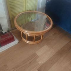 Round wicker coffee table with glass