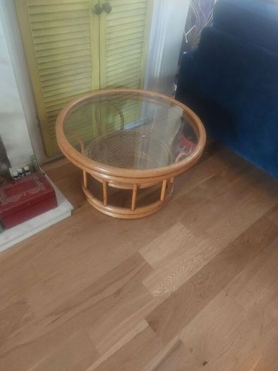 Round wicker coffee table with glass