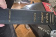 An original hardcover printing of Alfred Marshalls Principles of Economics eighth Edition published by Macmillan