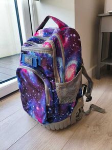 Galaxy print rolling backpack with extendable handle
