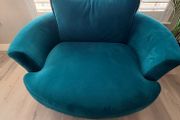 Teal love seat swivel.