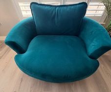 Teal love seat swivel.