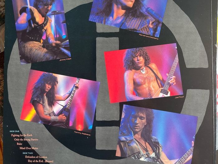 WARRIOR Fighting for the earth original 1985 release with inner lyric sheet vinyl record in near mint condition. Sleeve is vg with just some light wear along top of spine otherwise it would be nm