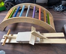 Wooden climbing arch and seesaw attachment