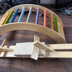 Wooden climbing arch and seesaw attachment
