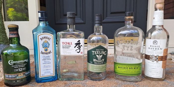 SIX FREE but empty liquor bottles