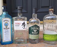 SIX FREE but empty liquor bottles