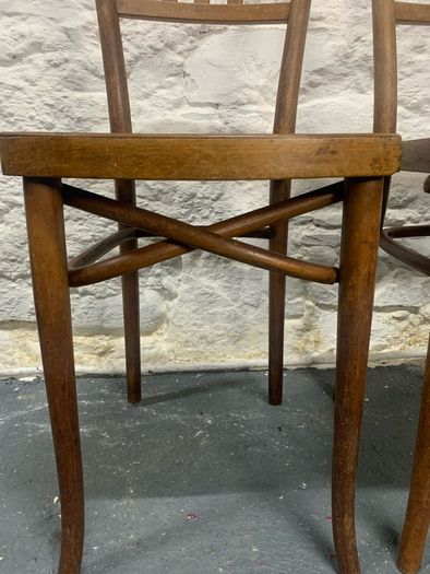 A pair of tall Thonet bentwood chairs.