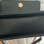 Black quilted flap shoulder bag with gold hardware Image 7