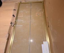 Brushed brass bifold shower door (1m)