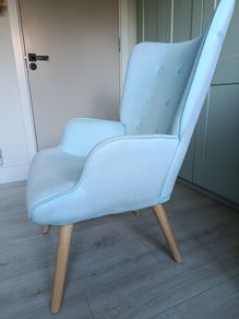 Light blue button-back armchair