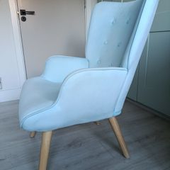 Light blue button-back armchair
