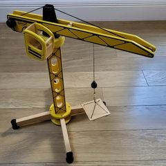 yellow wooden tower crane