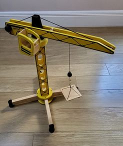 yellow wooden tower crane