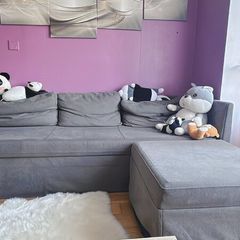 Grey fabric sofa with matching footstool