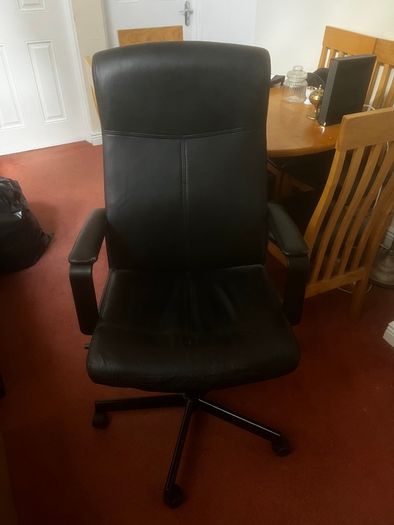 Ikea chair with one leg of the base broken