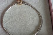 Authentic Pandora sterling silver bracelet with a 14k solid yellow gold clasp (marked G585 ALE).Size 18.5cm for the right size please check the last photos, in  very good condition