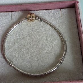 Authentic Pandora sterling silver bracelet with a 14k solid yellow gold clasp (marked G585 ALE).Size 18.5cm for the right size please check the last photos, in  very good condition