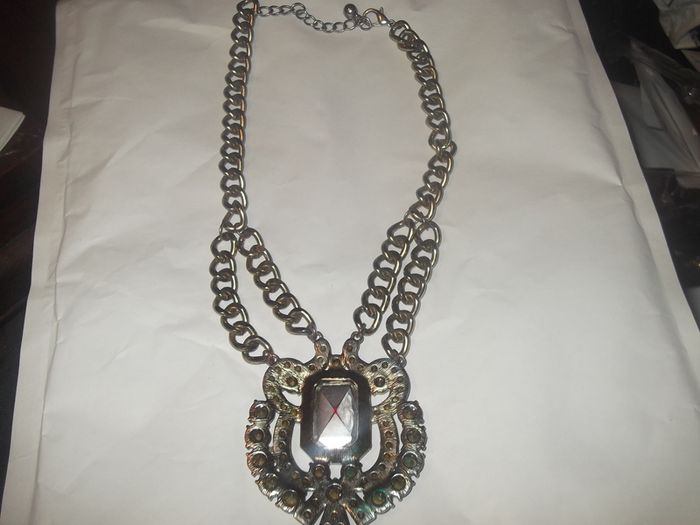a lovely vintage  costome jewelley pendent with white stones and a large red stone