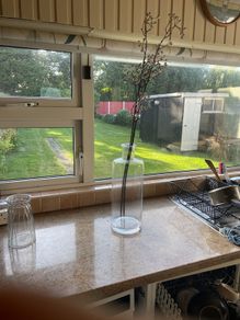 Glass vase and artificial flowers