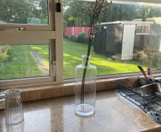 Glass vase and artificial flowers