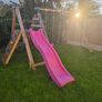 Wooden climbing frame with slide and swings Image 3