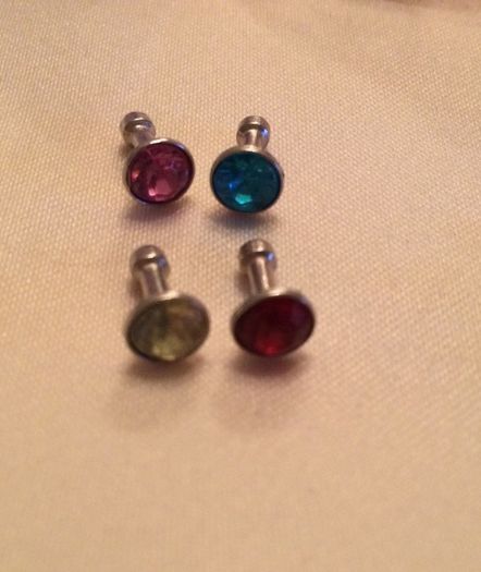Brand new 8 pack of diamond plug in dust covers for phone and tablets