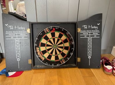 dartboard in cabinet