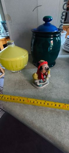 3 spreat items- Vintage Disney Mickey Mouse Figurine Fire Chief Fireman Hydrant Hose 3.5 inchs Korea 12.00 euro. 2 -  Denby Metz Storage Jar + Lid 38.00 euro. 3 - Candy, sugar, or trinkets yellow, ribbed glass storag and lid 32.00 euro.