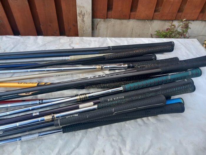 A selection of golf clubs and bags. Golf balls
