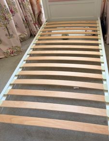Wooden Single bed with Pink Headboard
