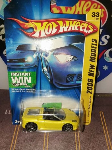 Hot Wheels Ferrari die-cast model cars from the mid-2000s and late 1990s card collections.