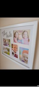 A pair of wall frames. Never used + Tesa power strips (x 10)