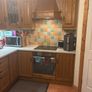 Wooden kitchen cabinets with dish washer and oven Image 5