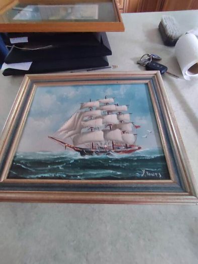 Framed oil of a sailing ship on board signed Y. Jones