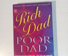 Rich Dad Poor Dad by Robert T. Kiyosaki with Sharon L. Lechter