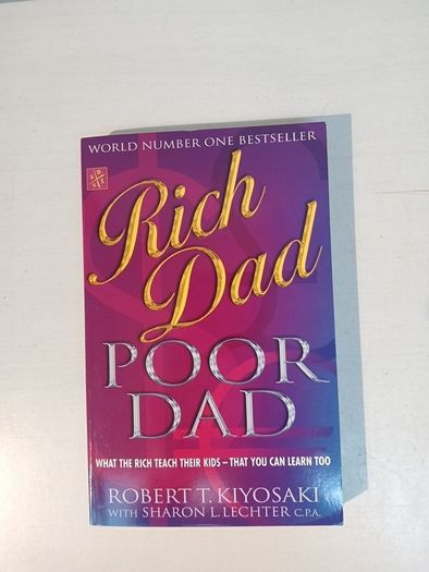 Rich Dad Poor Dad by Robert T. Kiyosaki with Sharon L. Lechter