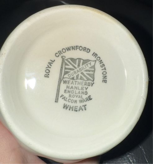 An antique Weatherby Design ironstone pitcher and bowl set featuring a wheat pattern.