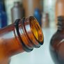 471 - Set of 4 Vintage Amber Glass Screw Top Collectible Decorative Bottles Image 9