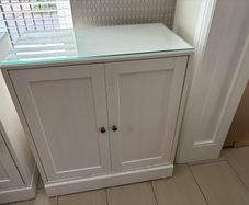 Solid wood cabinet in white with glass top