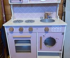 Wooden play kitchen with accessories