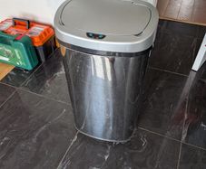 Large stainless steel bin with motion sensor open