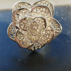 A 925 sterling silver cocktail ring in the shape of a flower.