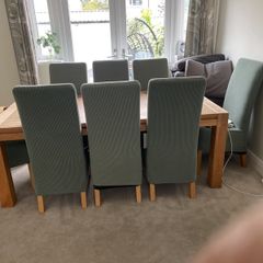 Solid oak dining table and 8 leather chairs