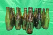 24 Antique 1/2 pint bottles in crate