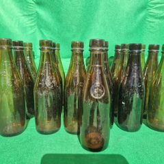 24 Antique 1/2 pint bottles in crate