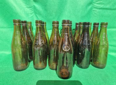 24 Antique 1/2 pint bottles in crate