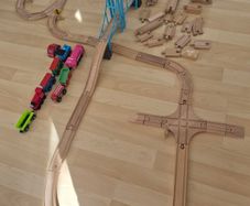 wooden train tracks and full box of Lego Duplo