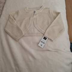 Baby girls gold shrug.